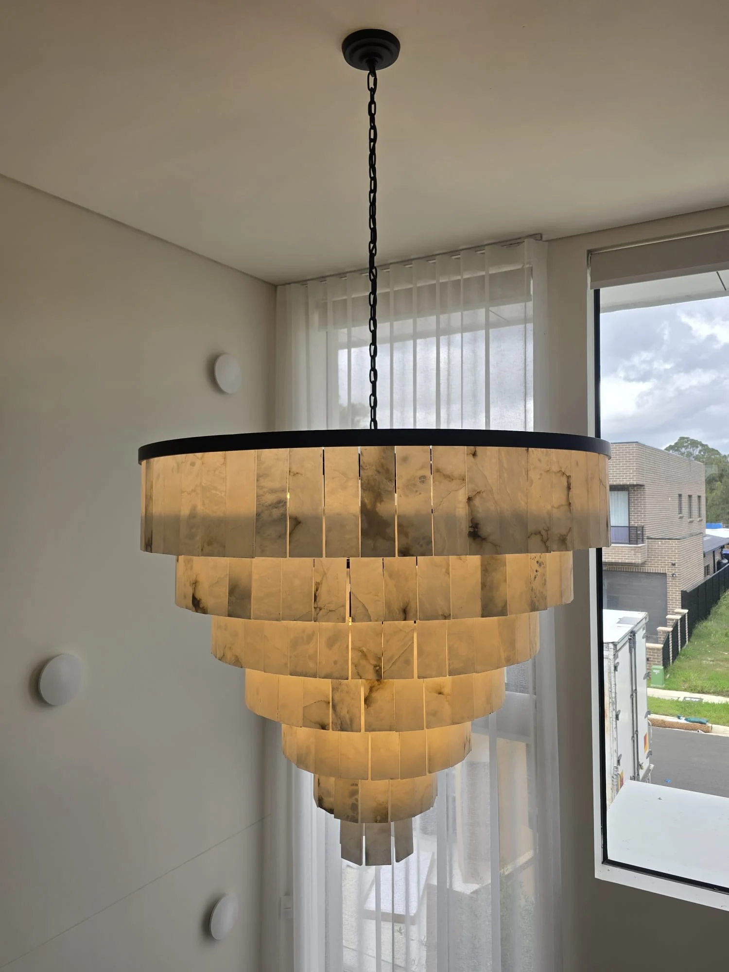 Tiered alabaster chandelier in a luxury residence
