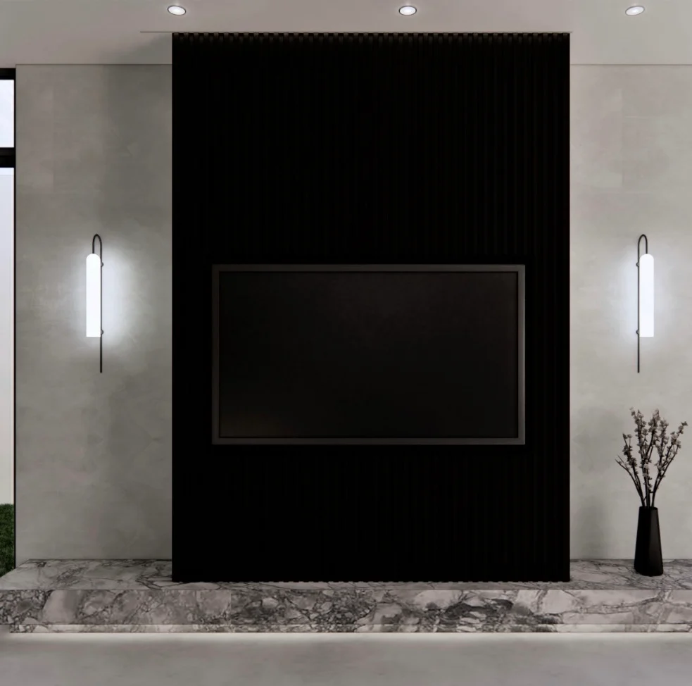 Slim wall sconces flanking a black feature fireplace wall